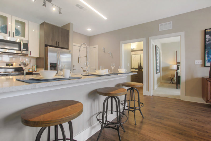 Helios - Kitchen With Stainless Steel Appliances And Chef’s Table-Sized Kitchen Island