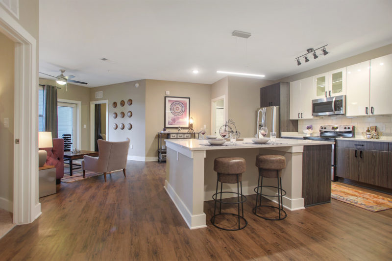 Helios - Kitchen With Stainless Steel Appliances And Chef’s Table-Sized Kitchen Island