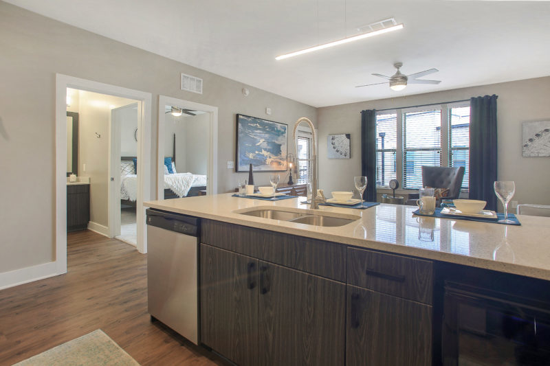 Helios - Kitchen With Stainless Steel Appliances And Chef’s Table-Sized Kitchen Island